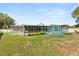 Spacious backyard with lush grass and playground equipment, ideal for outdoor activities at 1792 Killarney Dr, Winter Park, FL 32789