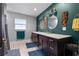 Elegant bathroom with double vanity and teal walls at 1792 Killarney Dr, Winter Park, FL 32789