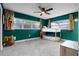 bedroom with bunk bed and teal walls at 1792 Killarney Dr, Winter Park, FL 32789