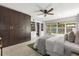 Bright bedroom features built-in shelving, a ceiling fan, and large windows at 1792 Killarney Dr, Winter Park, FL 32789