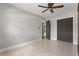 Cozy bedroom with neutral walls, closet and ceiling fan for a relaxing atmosphere at 1792 Killarney Dr, Winter Park, FL 32789