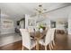 Bright dining room featuring a modern chandelier, hardwood floors and neutral decor at 1792 Killarney Dr, Winter Park, FL 32789