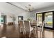 Dining room features hardwood floors, neutral decor, and a view to an outdoor seating area at 1792 Killarney Dr, Winter Park, FL 32789