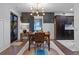 Bright dining area features dark kitchen cabinets and wood dining table at 1792 Killarney Dr, Winter Park, FL 32789