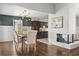 Dining area features a chandelier, dark wood cabinets, and a brick fireplace at 1792 Killarney Dr, Winter Park, FL 32789