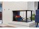 Modern electric fireplace with white brick surround at 1792 Killarney Dr, Winter Park, FL 32789