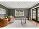 Cozy room with a foosball table, comfortable seating, and natural light from the window and glass doors at 1792 Killarney Dr, Winter Park, FL 32789