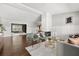 Spacious living room features modern decor, hardwood floors, and a white brick fireplace at 1792 Killarney Dr, Winter Park, FL 32789
