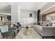 Bright living room featuring stylish furniture, hardwood floors, and a brick fireplace at 1792 Killarney Dr, Winter Park, FL 32789