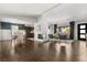 Open concept living and dining room with hardwood floors and a brick fireplace at 1792 Killarney Dr, Winter Park, FL 32789