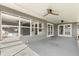 Large patio featuring ceiling fans with views to the backyard at 1792 Killarney Dr, Winter Park, FL 32789
