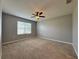 Spacious bedroom with ceiling fan and access to bath at 193 Grove Branch Rd, Winter Haven, FL 33880