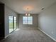 Bright dining room with sliding glass doors to backyard at 193 Grove Branch Rd, Winter Haven, FL 33880