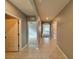 Bright and spacious hallway with tile flooring and arched doorways at 193 Grove Branch Rd, Winter Haven, FL 33880