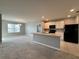 Modern kitchen with white cabinets, black appliances, and an island at 193 Grove Branch Rd, Winter Haven, FL 33880