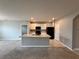 Modern kitchen with island and stainless steel appliances at 193 Grove Branch Rd, Winter Haven, FL 33880