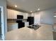 Kitchen island with double sink and granite countertop at 193 Grove Branch Rd, Winter Haven, FL 33880