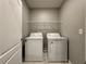 Bright laundry room with washer and dryer at 193 Grove Branch Rd, Winter Haven, FL 33880