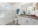 Clean bathroom with a walk-in shower and modern vanity at 193 Hampton Loop, Davenport, FL 33837