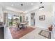 Elegant dining room with large sliding doors leading to a backyard view at 193 Hampton Loop, Davenport, FL 33837