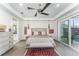 Bright main bedroom with ample space, sliding door access to the pool, and en-suite bath at 193 Hampton Loop, Davenport, FL 33837