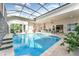 Inviting, refreshing pool area with a covered patio and comfortable seating at 193 Hampton Loop, Davenport, FL 33837