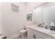 Convenient powder room with white vanity and toilet at 193 Hampton Loop, Davenport, FL 33837