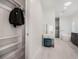 Closet and bathroom with a vanity and soaking tub at 1975 Biscayne Dr, Winter Park, FL 32789