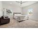 Spacious bedroom with large windows and ceiling fan at 1975 Biscayne Dr, Winter Park, FL 32789