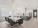 Dining area features a marble top table and gray chairs at 1975 Biscayne Dr, Winter Park, FL 32789