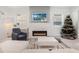 Modern living room fireplace with white brick and TV above at 1975 Biscayne Dr, Winter Park, FL 32789