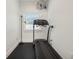 Small home gym with treadmill and flooring at 1975 Biscayne Dr, Winter Park, FL 32789