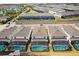 Aerial view of backyard pools screened in with privacy hedges at 1986 Summer Dr, Davenport, FL 33897