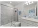 Bathroom featuring a vanity, toilet, and a glass-enclosed shower with a view of the connected bedroom at 1986 Summer Dr, Davenport, FL 33897
