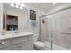 Clean bathroom with a white vanity, quartz countertop, shower and access to the bedroom at 1986 Summer Dr, Davenport, FL 33897