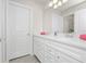 Bathroom with double vanity and white cabinets at 1986 Summer Dr, Davenport, FL 33897