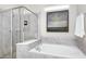 Relaxing bathroom with a soaking tub and walk-in shower at 1986 Summer Dr, Davenport, FL 33897