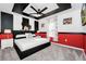 Mickey Mouse themed bedroom with a king-size bed and red accents at 1986 Summer Dr, Davenport, FL 33897