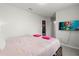 Cozy bedroom features a comfortable bed with pink accents and a TV for entertainment at 1986 Summer Dr, Davenport, FL 33897