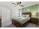 Comfortable bedroom features neutral tones, a wood headboard, and ample natural light at 1986 Summer Dr, Davenport, FL 33897