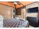 Spacious bedroom with a brick wall, themed decor, and a door leading to the bathroom at 1986 Summer Dr, Davenport, FL 33897