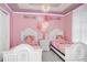 Princess themed bedroom with two twin beds at 1986 Summer Dr, Davenport, FL 33897