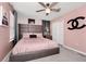 Stylish bedroom with a pink color scheme and a large bed at 1986 Summer Dr, Davenport, FL 33897