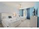 Bright bedroom featuring two queen beds, a ceiling fan, and stylish, coordinated decor at 1986 Summer Dr, Davenport, FL 33897