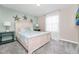 Bright bedroom with a queen-size bed and coastal decor at 1986 Summer Dr, Davenport, FL 33897