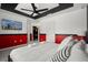 Vibrant bedroom boasts a modern TV, unique decor, and cozy bedding at 1986 Summer Dr, Davenport, FL 33897