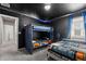 Charming bedroom with black ceiling, unique bunkbeds, custom lighting, and a Star Wars themed design at 1986 Summer Dr, Davenport, FL 33897