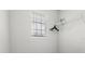 Simple closet space with a window and shelf for storing clothing and accessories at 1986 Summer Dr, Davenport, FL 33897
