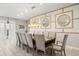 Elegant dining room featuring a large table with seating for ten and decorative wall accents at 1986 Summer Dr, Davenport, FL 33897