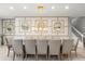 Dining area featuring a large table with seating for ten, plus decorative wall with mirrors at 1986 Summer Dr, Davenport, FL 33897